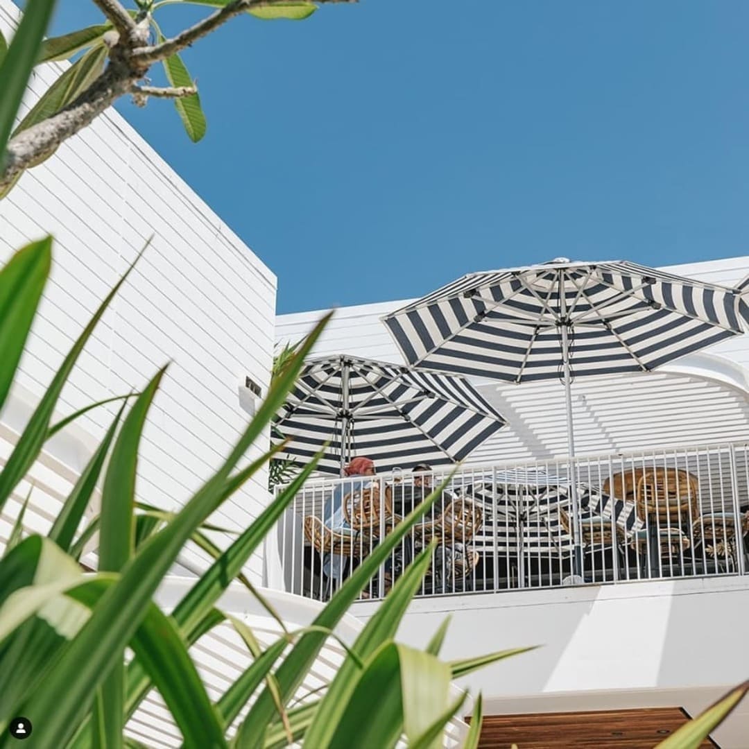 2.8m Caspar Patio Umbrella by Basil Bangs with UPF50+ protection, durable stainless steel frame, and minimalist design for outdoor spaces.