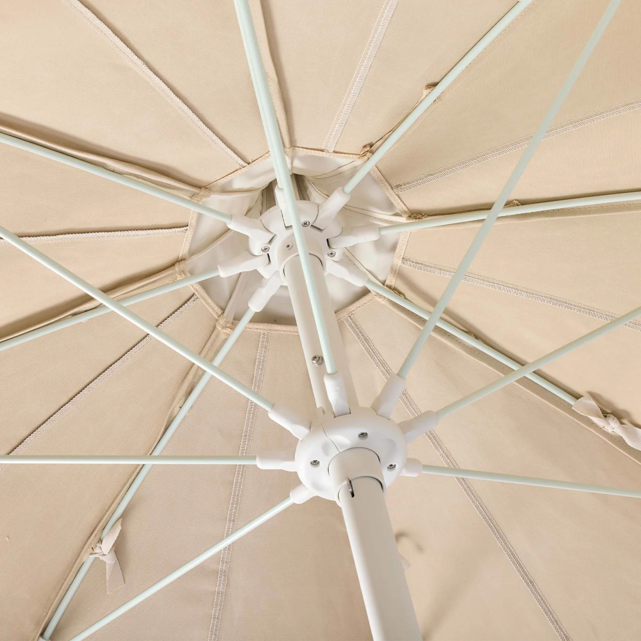 A 210 cm outdoor umbrella combining timeless design, flexible fibreglass ribs, and replaceable parts for long-lasting performance.