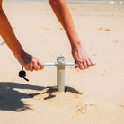 Aluminium ground anchor designed to secure umbrellas on sand and soft terrain with dependable stability.